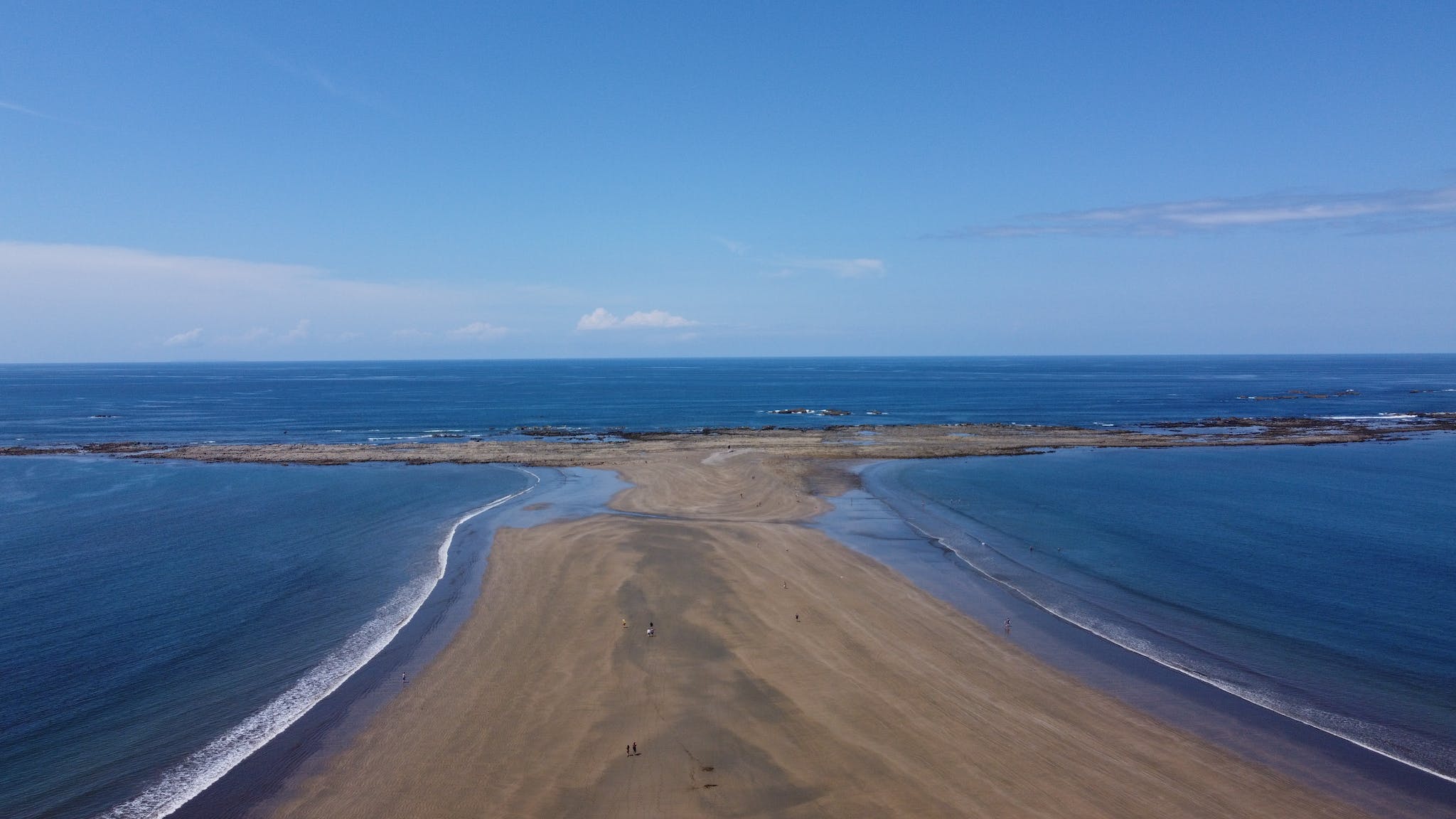 Brown Sand Between Beaches a Under Blue Sky