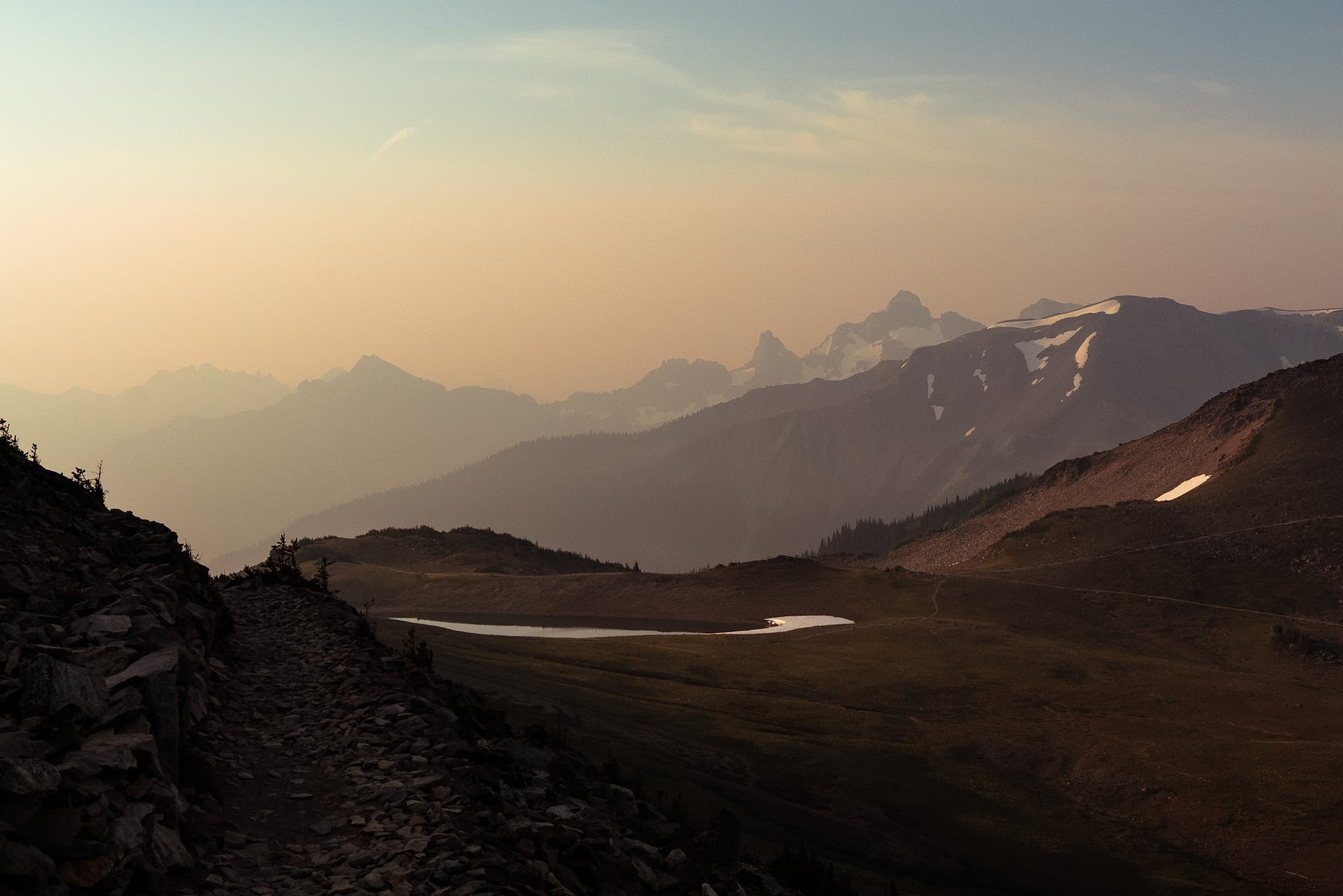 Landscape with field against mountains